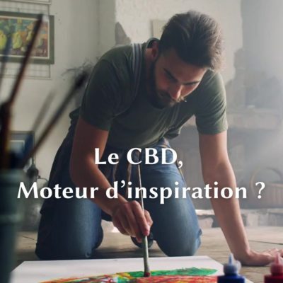 Artiste peintre inspiré par le CBD, en pleine création artistique dans un atelier lumineux